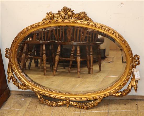 A Louis XVI style giltwood oval wall mirror W.94cm